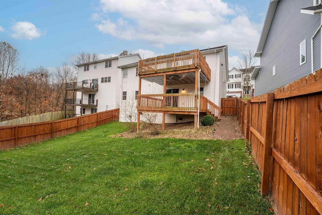 back of house featuring a yard and a deck