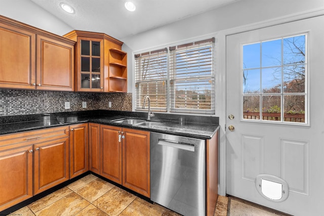 kitchen featuring plenty of natural light, sink, decorative backsplash, and dishwasher