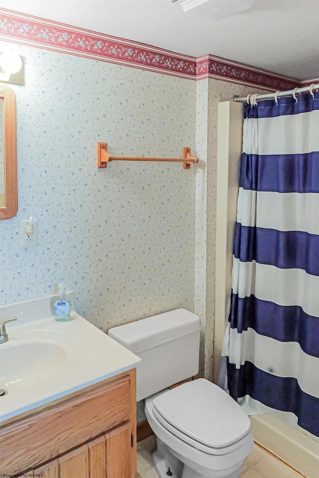 bathroom with toilet, vanity, tile patterned flooring, and curtained shower