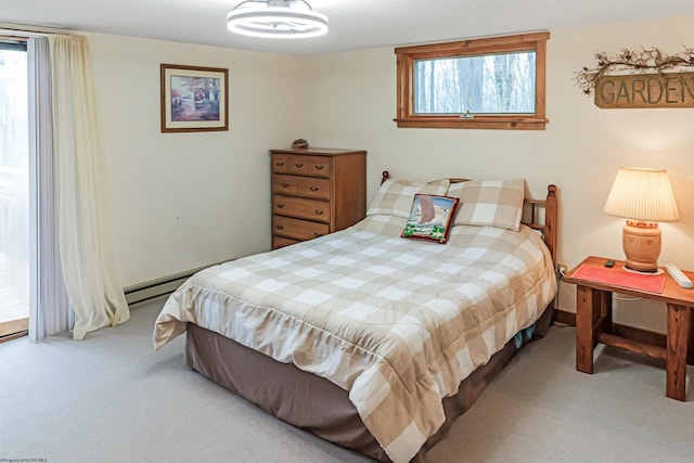 bedroom featuring light carpet and multiple windows