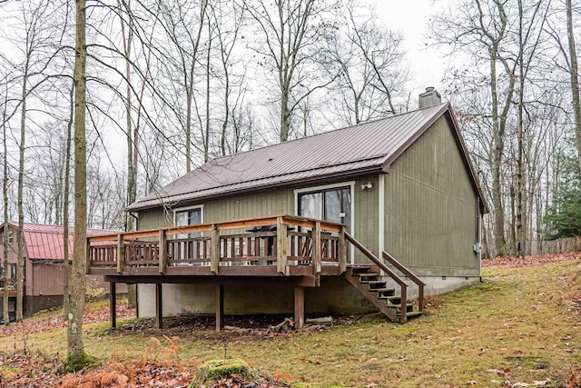 back of house with a yard and a wooden deck