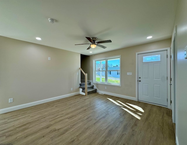 foyer entrance featuring ceiling fan and light hardwood / wood-style flooring