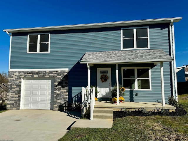 front of property featuring a garage and a porch