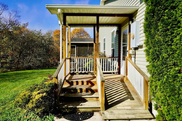 wooden terrace with a yard