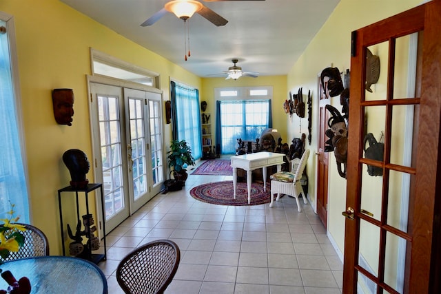 interior space featuring ceiling fan, french doors, and light tile patterned flooring