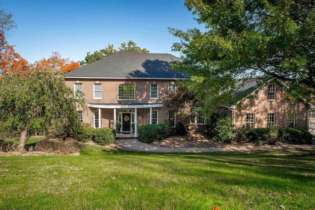 back of house featuring a yard