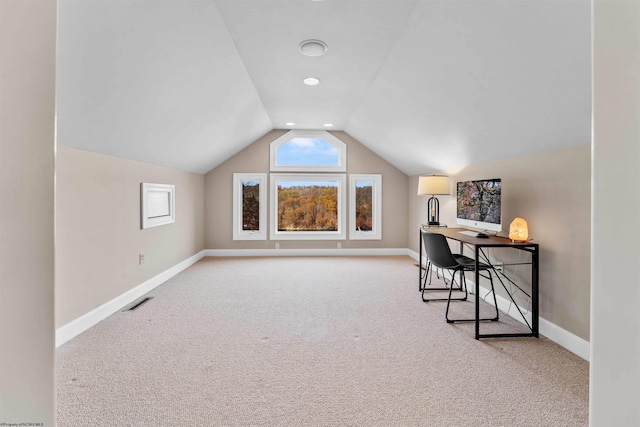 bonus room featuring lofted ceiling and light carpet