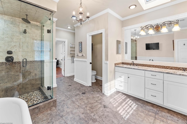 full bathroom with ornamental molding, a skylight, vanity, shower with separate bathtub, and toilet