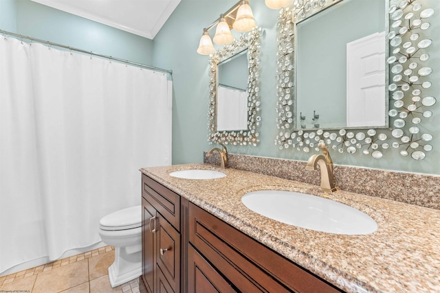 bathroom with toilet, vanity, tile patterned flooring, and ornamental molding