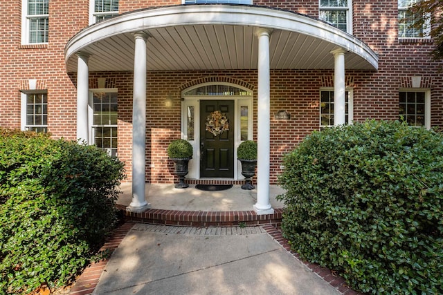 doorway to property featuring covered porch