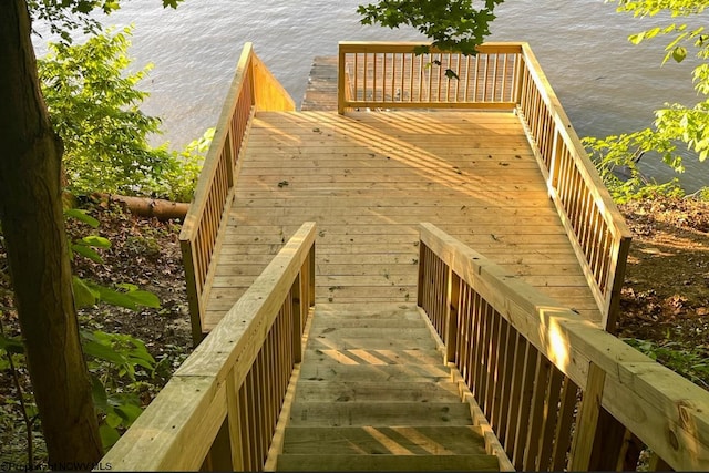 wooden deck featuring a water view