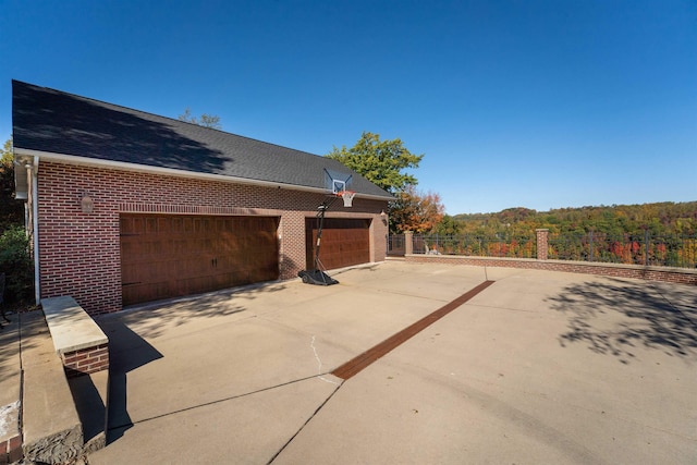 view of side of home with a garage