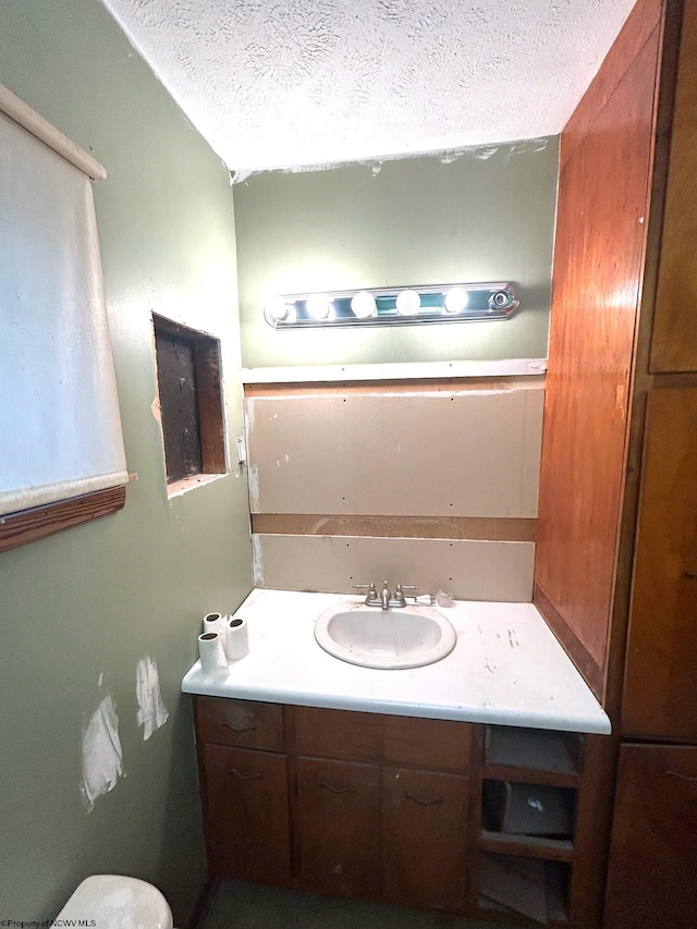 bathroom featuring vanity and a textured ceiling