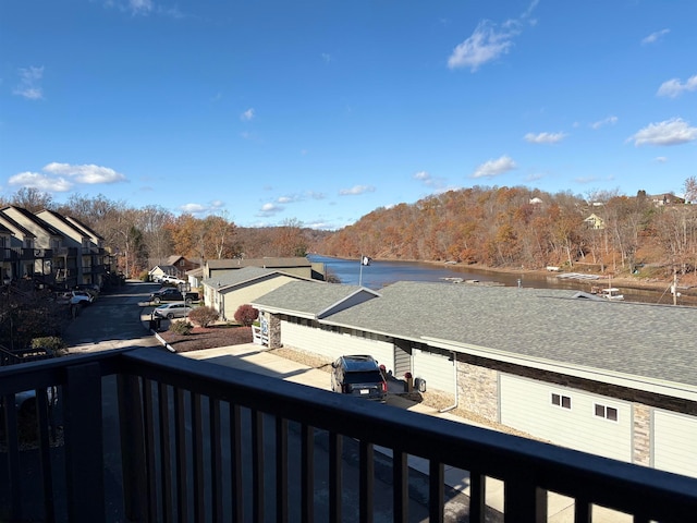 balcony featuring a water view