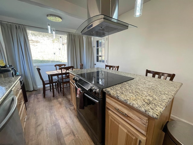 kitchen featuring hardwood / wood-style flooring, island range hood, a kitchen island, black electric range oven, and dishwasher