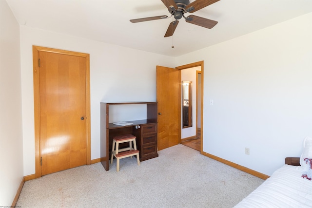 bedroom with light carpet and ceiling fan