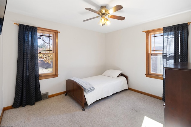 carpeted bedroom featuring ceiling fan