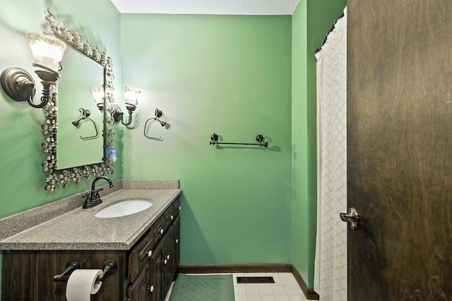 bathroom with vanity and tile patterned floors