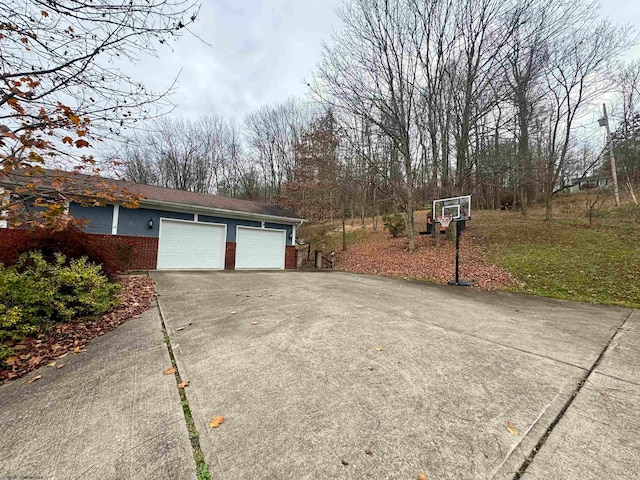 view of side of home with a garage