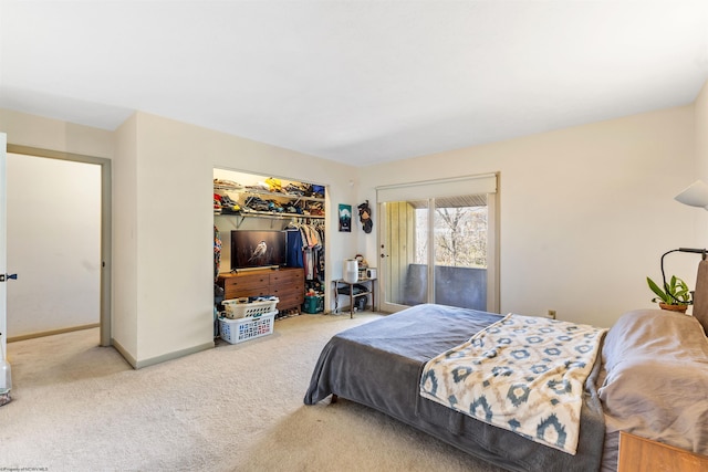 bedroom featuring a closet, carpet, and access to exterior