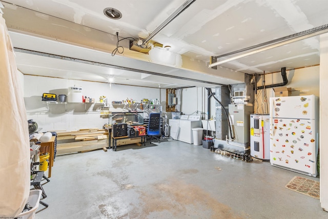 garage with electric water heater, heating unit, washer and dryer, white fridge, and a garage door opener