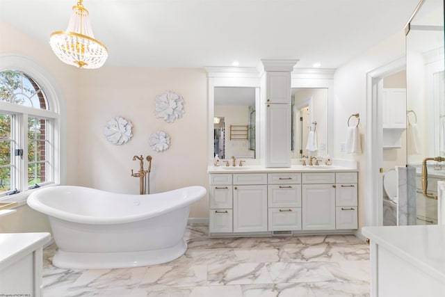 bathroom featuring vanity and independent shower and bath