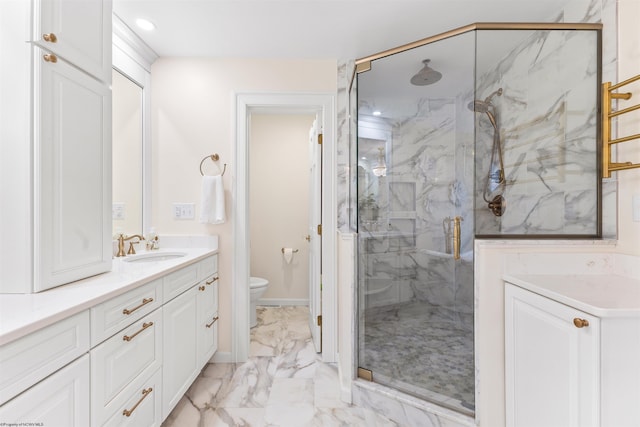 bathroom with vanity, an enclosed shower, and toilet