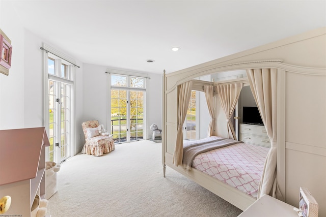 carpeted bedroom featuring access to outside