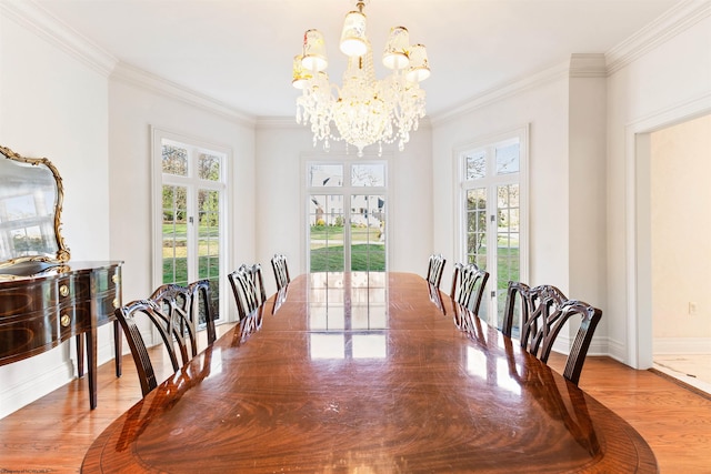 dining space featuring hardwood / wood-style flooring and ornamental molding