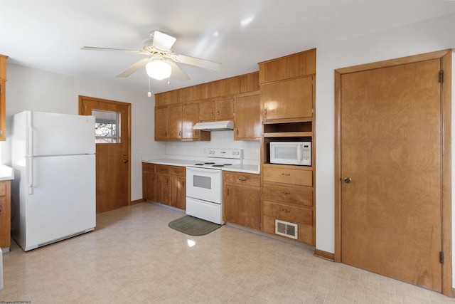 kitchen featuring white appliances and ceiling fan