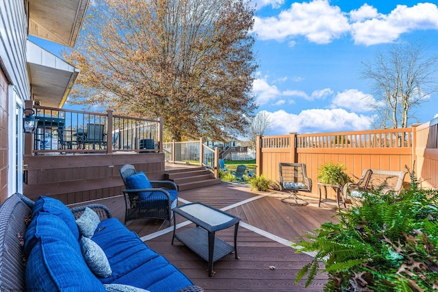 wooden deck featuring outdoor lounge area