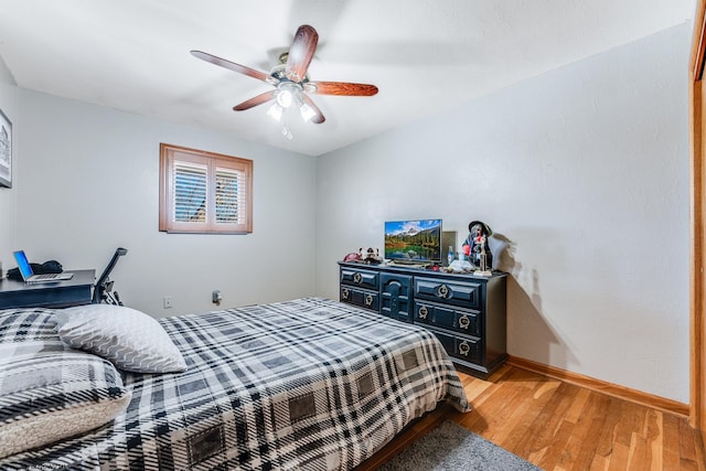 bedroom featuring wood-type flooring and ceiling fan