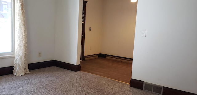 unfurnished room featuring carpet flooring