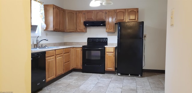 kitchen with black appliances, sink, and extractor fan