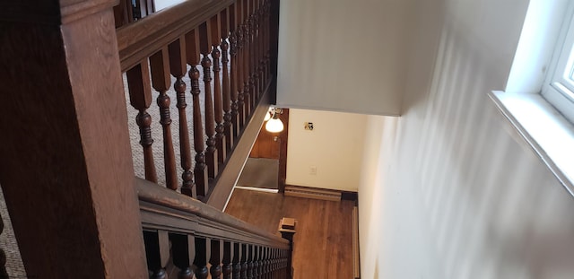 staircase featuring hardwood / wood-style flooring