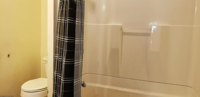 details featuring shower / bath combination with curtain and toilet