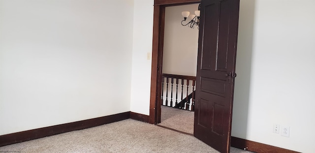 empty room featuring light colored carpet