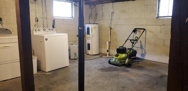 basement featuring separate washer and dryer and electric water heater