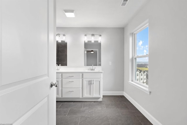 bathroom featuring tile patterned floors, ceiling fan, and vanity