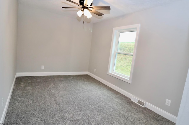 carpeted empty room featuring ceiling fan