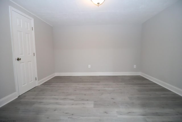 additional living space featuring hardwood / wood-style flooring