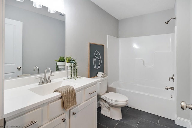 full bathroom with tile patterned floors, vanity, toilet, and washtub / shower combination