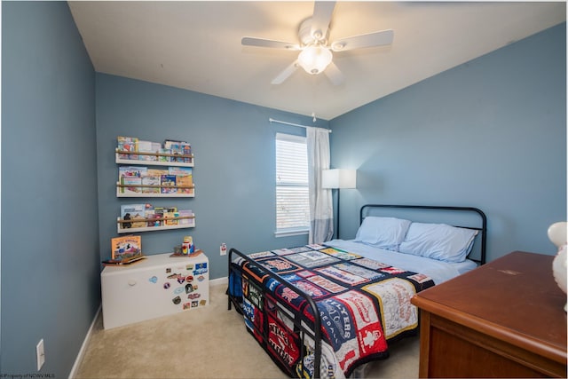 bedroom with ceiling fan and light carpet