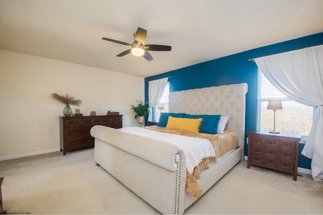 bedroom with light colored carpet and ceiling fan