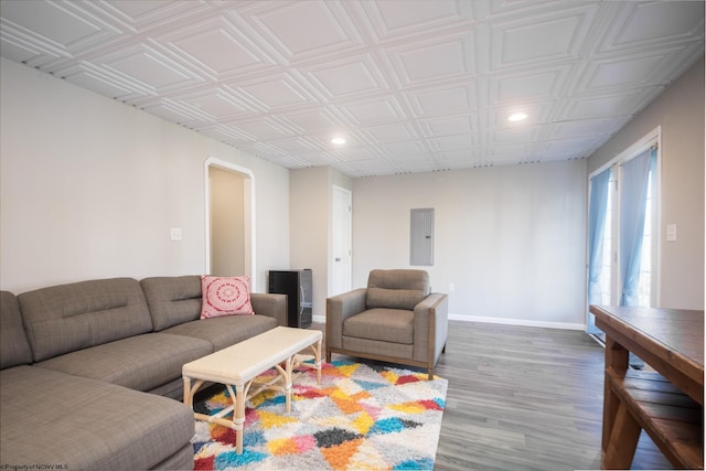 living room with hardwood / wood-style floors and electric panel