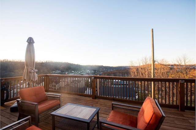 wooden deck featuring outdoor lounge area