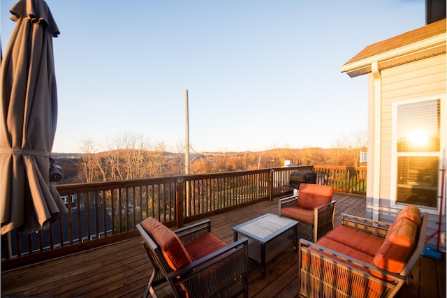 wooden terrace with outdoor lounge area