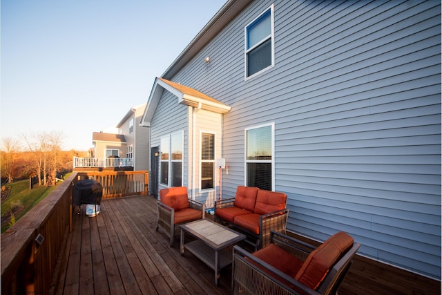 wooden terrace with outdoor lounge area