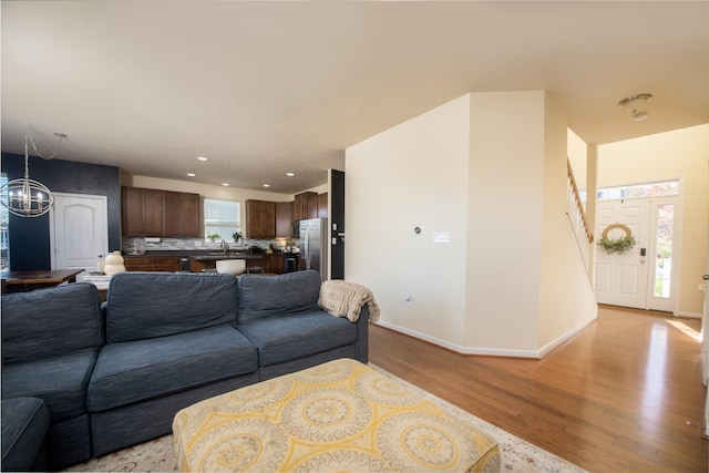 living room with light hardwood / wood-style floors and a wealth of natural light