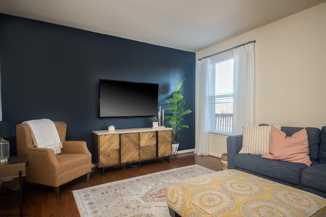 living room with dark hardwood / wood-style flooring